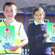 Adam Hizzy and Billie Morris-Davies are Junior Road Safety Officers. 084123-2. Picture by James Maggs.