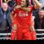 Andy Carroll (bottom) and Luis Suarez