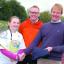 George Snell (right), Madley Tennis Club's chairman, and school headteacher Lee Batstone, congratulate Niamh Massam-Vallely on her winning T-shirt design
