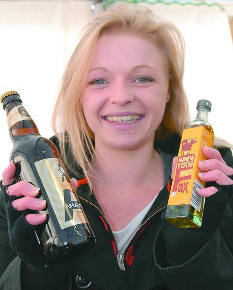 Sharon Hydes from Celtic Marches with a bottle of Abrahalls cider and Slightly Foxed.