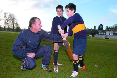 Christiaan Ferreira, Herefordshire Cricket Coaches Association chairman, gives some tips to Billy Turner and Luke Tulecz at Wyeside.