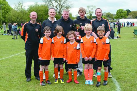 Rear from left; coaches and committee members Julian Lewis, Mark
Richards (chairman), Mike Lewis and Owain Lloyd – between them – Owen
Pritchard, who plays for the under 16s, with the league trophy; front; Seb Beebee,
Ashton Taylor, Luke Doyle, Joe