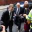 Stuart Hall, centre, arrives at Preston Crown Court where he was jailed for indecent assault