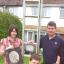  Matthew Preece with his children, Naomi and Kieran, and wife Haley and family pictures damaged in the blaze. 081931-1.