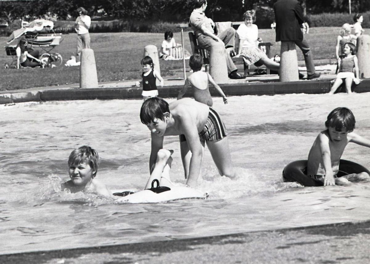 Children playing in the paddling pool on the King George V playing fields in Hereford. 5th August, 1974.