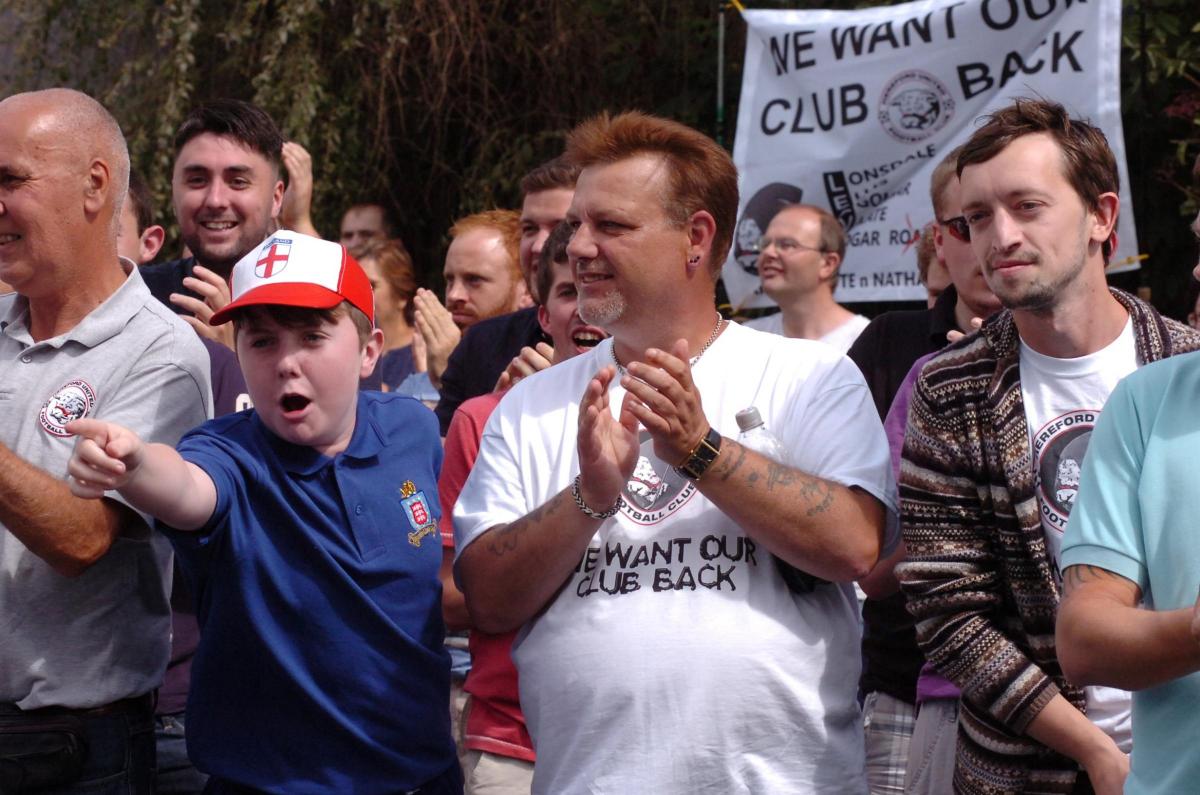 Fans protest outside the ground before the match. 