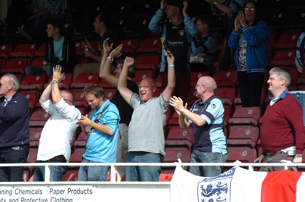 St. Neot's fans celebrate their first goal.