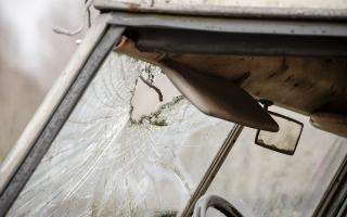 Burglars broke a vehicle's window with a hammer after breaking into a garage