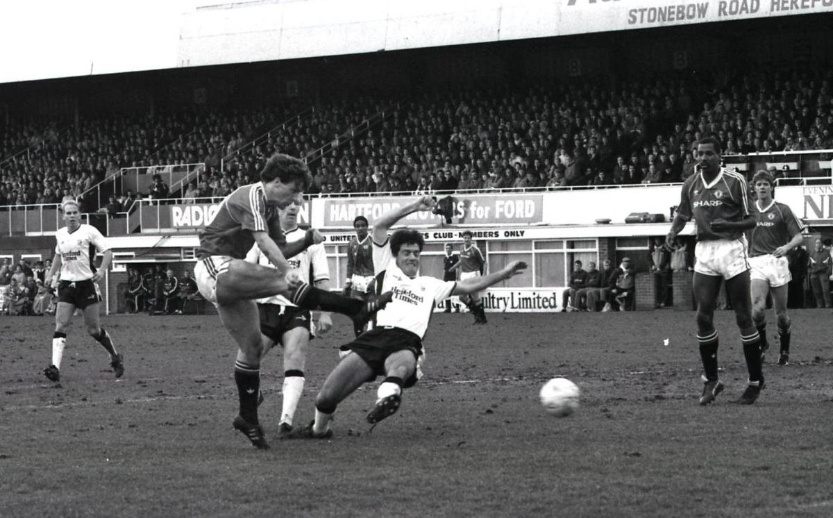 Mark Hughes shoots challenged by Steve Devine & watched by Mark Jones & Paul Tester.