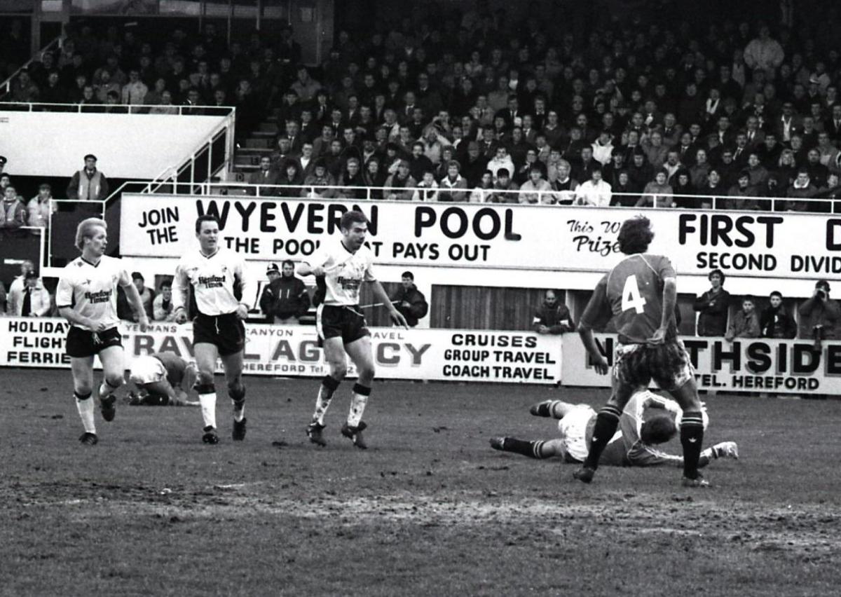 Jim Leighton saves a shot from Colin Robinson.