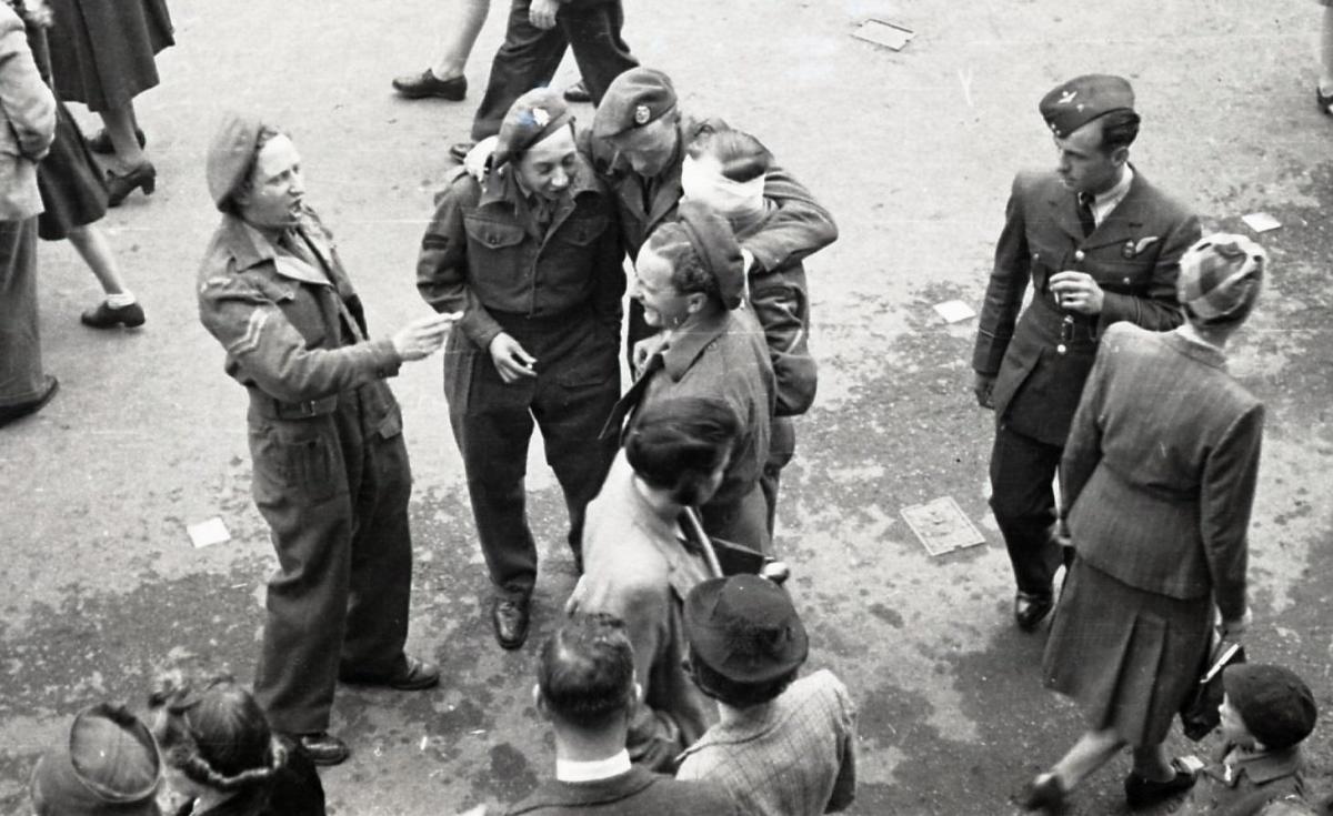 V.E. Holiday in Hereford, 8th-9th May 1945. Soldiers sing during the celebrations in High Town.