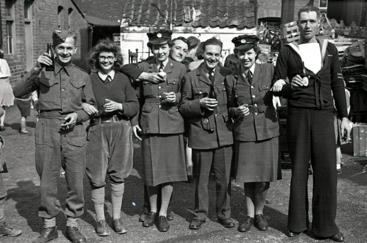 V.E. Holiday in Hereford, 8th-9th May 1945. Service men & women at a Berrington Street tea party.