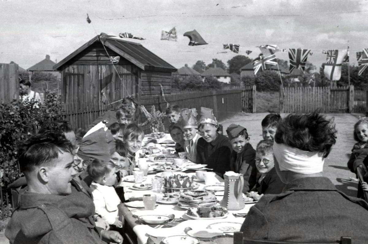 V.E. Holiday in Hereford, 8th-9th May 1945. Children talking to soldiers at the Chestnut Drive tea party.