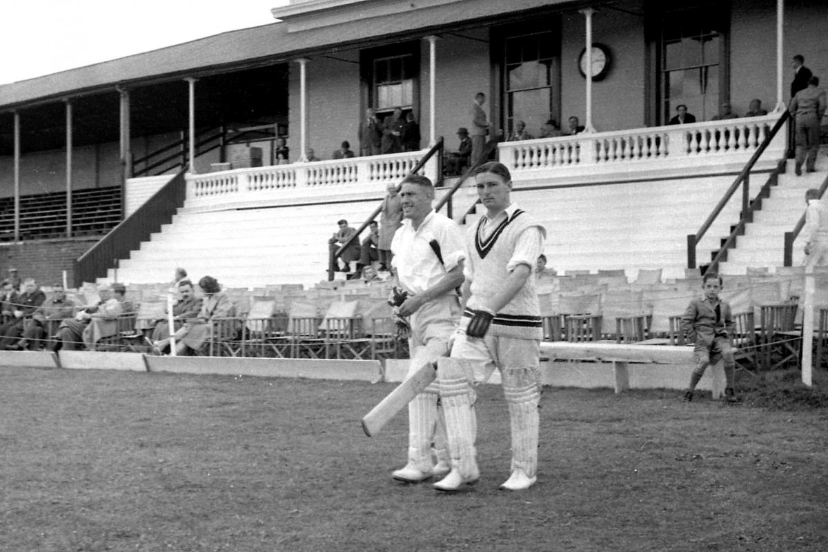 Cricketers walking out to bat at the City Sports Club in Hereford. 1947.