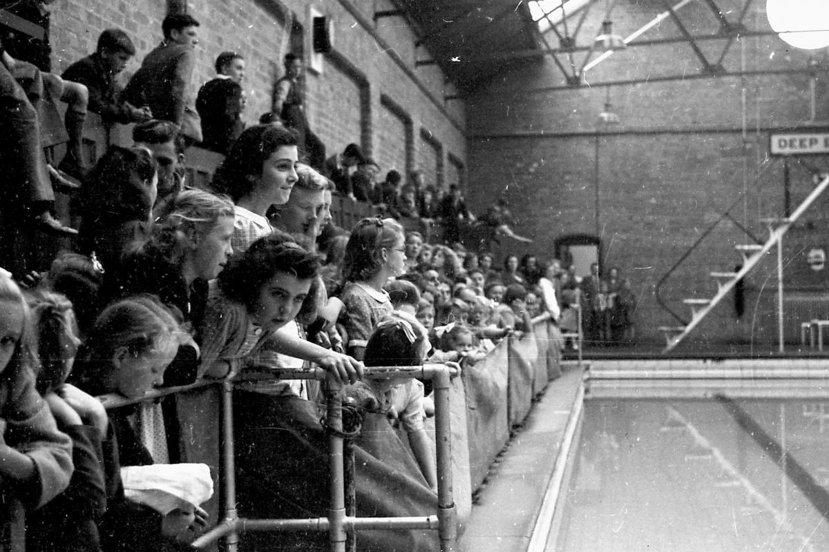 Swimming gala at Hereford Baths on Edgar Street. November 3rd 1945.  Spectators watching the gala.