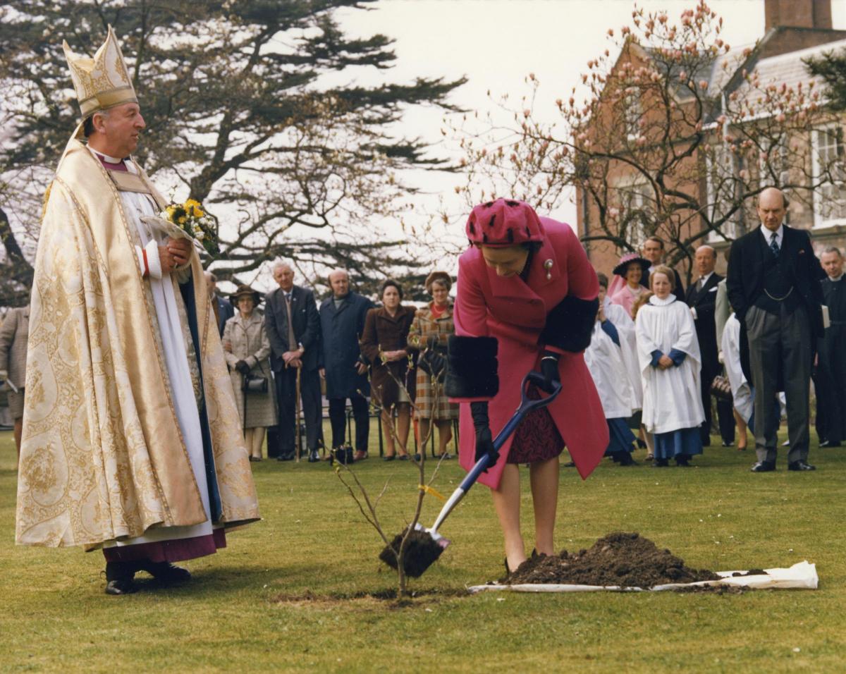 Planting a tree in the garden of the Bishop's Palace, watched by the Bishop of Hereford, the Rt Rev John Eastaugh.
Photos: Derek Foxton Collection; and Peter Norman