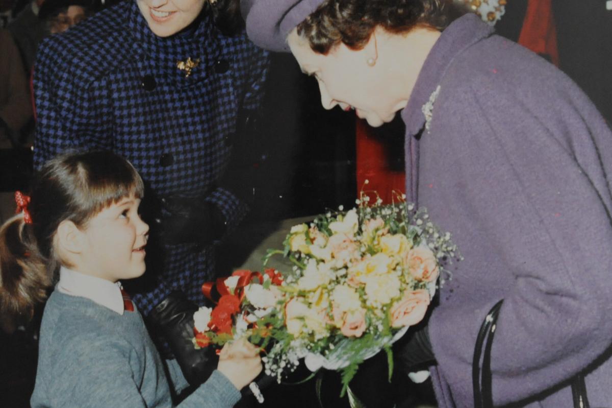 A bouquet from the Queen from a young well-wisher, during her 1987 visit