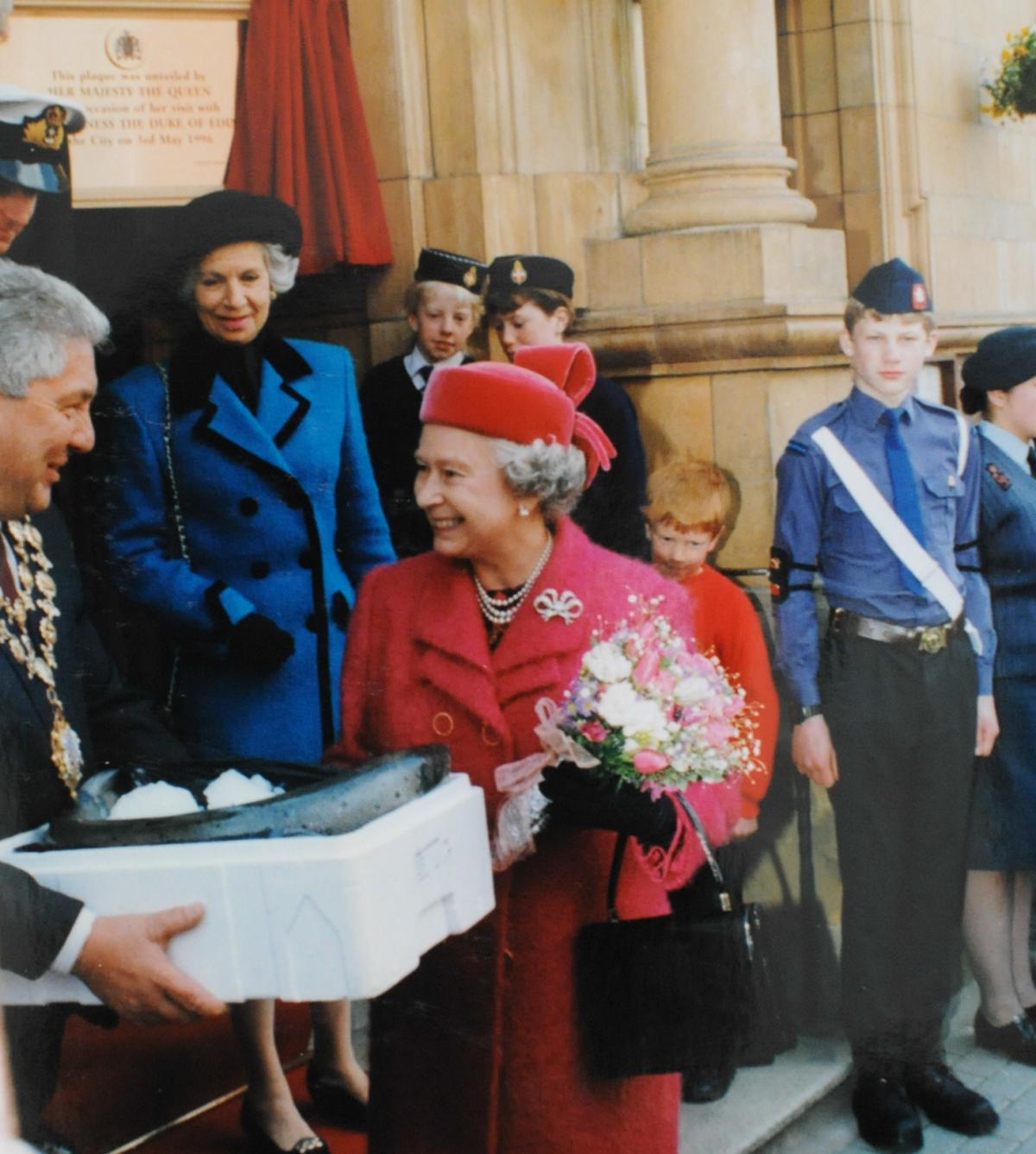 Mayor George Hyde presents the Queen with a salmon taken from the Wye just before her visit, in 1996