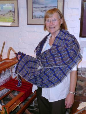 Marion Willcocks displaying her hand woven Highland Tweed.