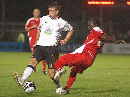 Andy Williams wins the ball against Kevin Amankwaah.