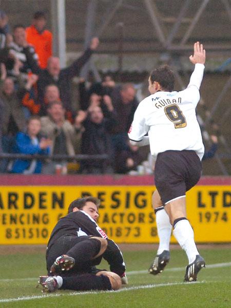 Steve Guinan celebrates next to Shane Higgs after scoring the opening goal for Hereford.