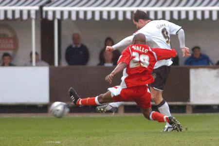 Steve Guinan scores the second goal for Hereford.