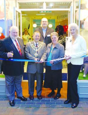 Hereford Mayor Councillor Kevin Wargen cuts the ribbon to open the new store.