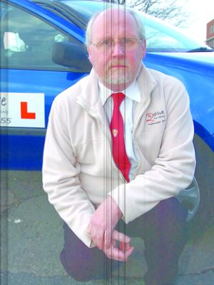 Driving instructor Phil Brown is anxious the standard of training is maintained. 090615-3.