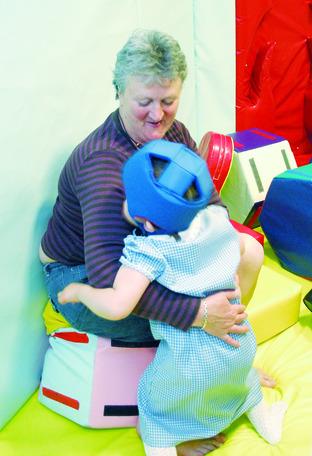 Teaching assistant Sue String with pupil Molly Lloyd.