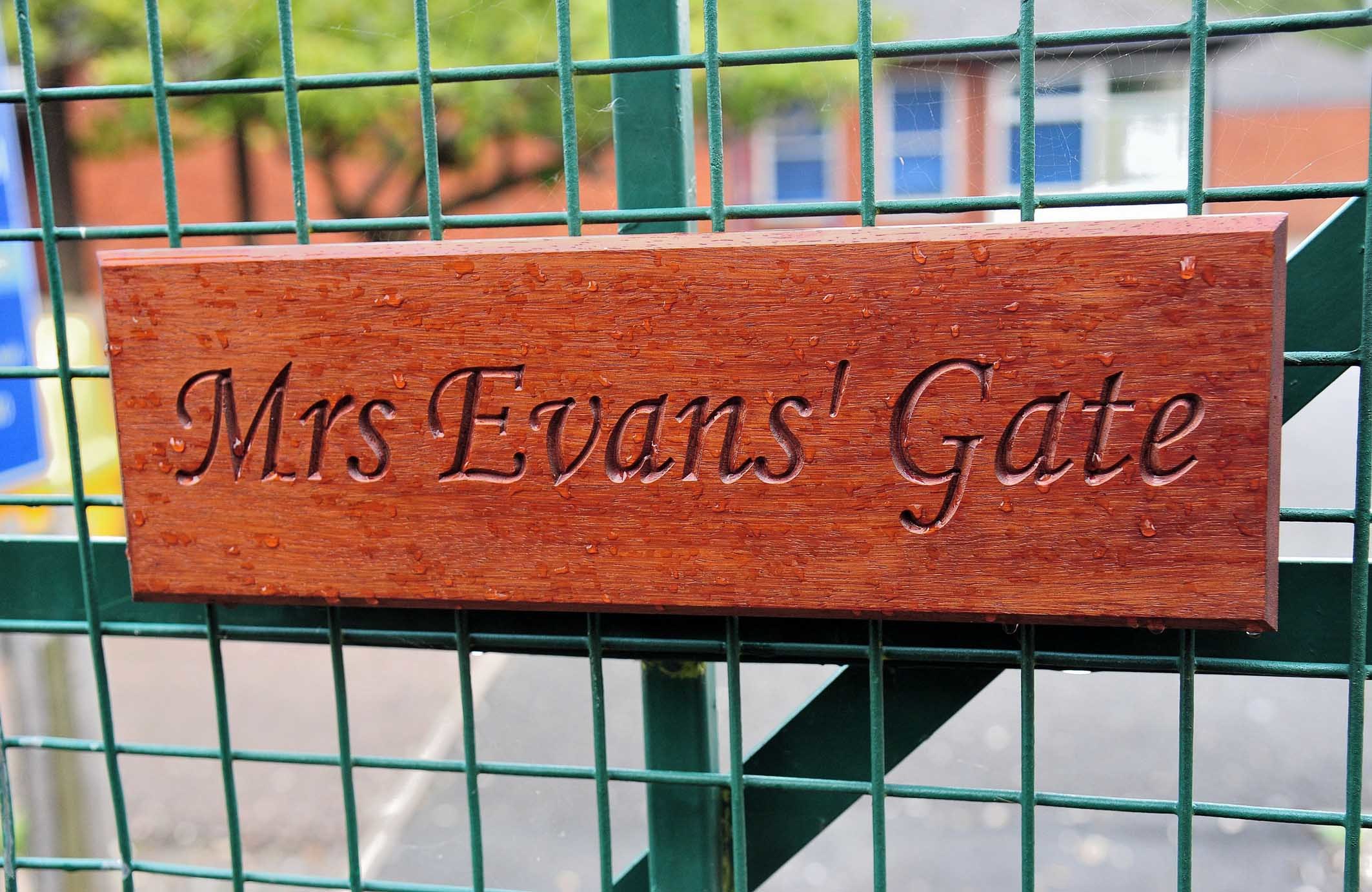 The wooden plaque on the gate at Ledbury Primary School, in memory of former deputy headteach er Jill Evans