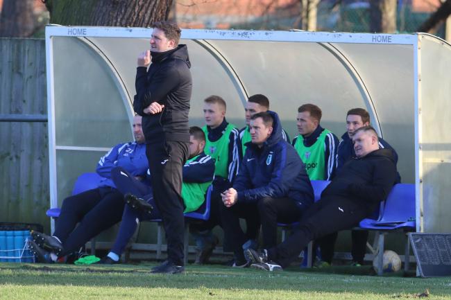 Phil Glover with his management team in the Westfields dugout. Picture: Steve Niblett