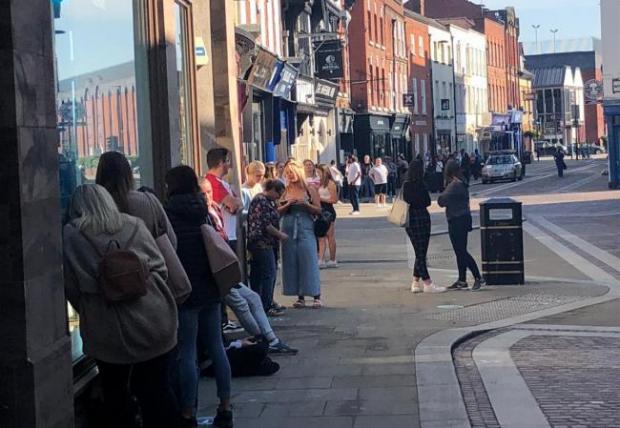 Hereford Times: People queuing in Widemarsh Street to get into Primark. Picture: Ben Goddard