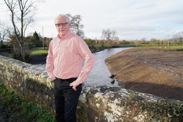 Hereford Times: Farmer John Price pictured next to the river Lugg in December 2020. Picture: Rob Davies