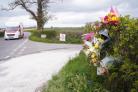 The scene where the fatal crash happened on the B4348 near Thruxton...Flowers and tributes left where the serious road traffic collision happened...Flowers left at the scene where the fatal crash happened...Floral tributes left to car crash victim..