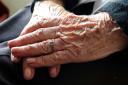A general view of a close up of the hands of an elderly woman at home..