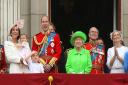 Queen Elizabeth II joining members of the royal family, including the Duke and Duchess of Cambridge with their children Princess Charlotte and Prince George, on the balcony of Buckingham Palace (PA)