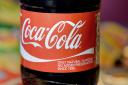 The Coca-Cola Company has announced it will suspend all business in Russia, after calls for it to stop selling its products in the country (PA)