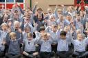 Year 1 and year 2 puils at Trinity Primary School celebrate after being awarded ‘School of the Month’.    Pictures: Rob Davies