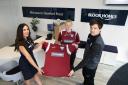 Westfields FC Women's goalkeeper I’Lavva Jenkins (centre) and team manager Ben Archer (right) receiving the team’s new shirts from Emma Mitchell, sales adviser at Bloor Homes’ Hereford Point development