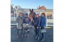 Trainer Venetia Williams (right) celebrates a double as Alcedo won the D Virgin 535 Open NH Flat Race. Pictured with jockey Charlie Deutsch (second left) and horse owner Mr P Davies