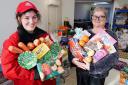 Vennture intern Immi Abbott (left) and hamper coordinator Becca Huggett with some of the essentials in a Hereford Times Christmas appeal hamper.
