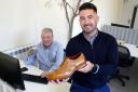 Samuel Windsor owners Rob Burton, left, and Ed Bullock, right, with a selection of handmade leather shoes at their offices in Hereford High Town. Picture: Rob Davies