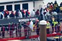 A group of people thought to be migrants are brought in to Dover, Kent, onboard a Border Force vessel