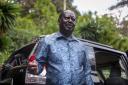 Kenya’s opposition leader Raila Odinga speaks next to one of his vehicles he says was struck by a teargas canister fired by riot police, at his home in Nairobi, Kenya Friday, March 31, 2023. In an interview with The Associated Press on Friday, Odinga
