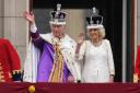 King Charles III and Queen Camilla wave to the crowds from Buckingham Palace's balcony