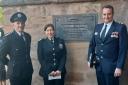 From left: Hereford Station Commander Alex Hustwayte, Area Commander Sam Pink and Watch Commander Ady Morris next to the memorial plaque