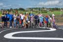 Para-cyclist Daphne Schrager celebrates the opening of Hereford's new cycle track along with families