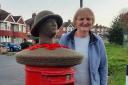 Sue Cockroft next to the Remembrance post box topper in Ross Road, Hereford