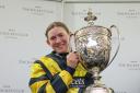 : Lucy Turner celebrates victory aboard Chambard at Aintree over the world-famous Grand National fences