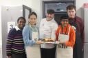 The judges, Saku Chandrasekara and Mark Hyde-Catton, with competition organiser, Fionn Holden, and star bakers Guoguo Zhang and Sonali Shah